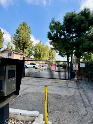 a view of a street with a fence
