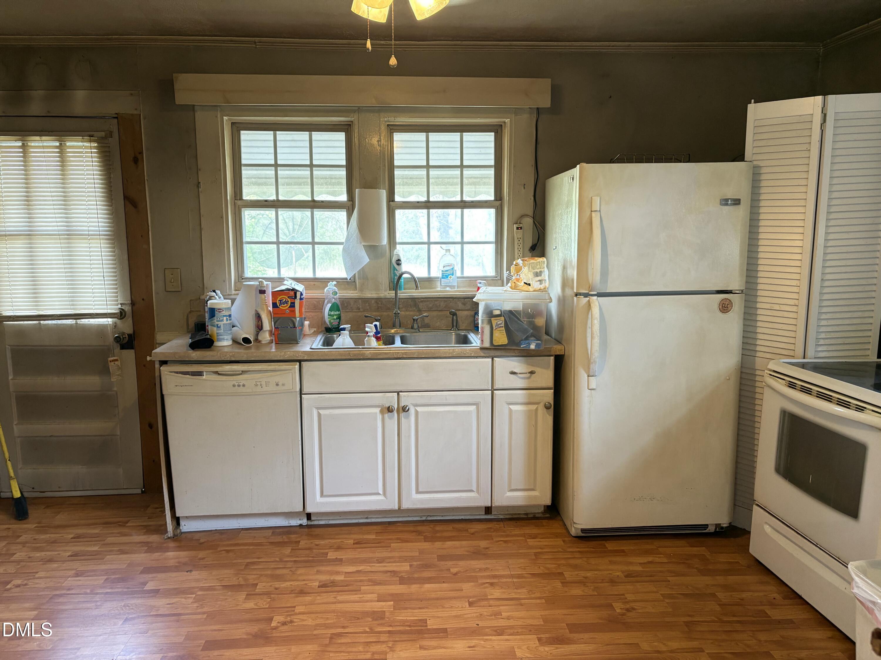 1204 Winfred Brady Road Bennett, NC 27208 - Photo 12 of 16 a white refrigerator freezer sitting inside of a kitchen