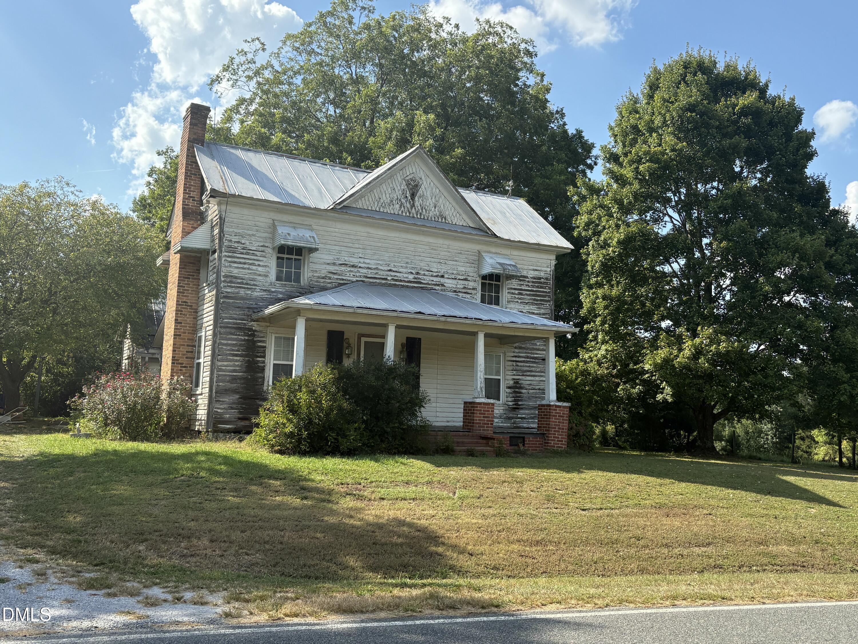 1204 Winfred Brady Road Bennett, NC 27208 - Photo 3 of 5 a front view of a house with garden