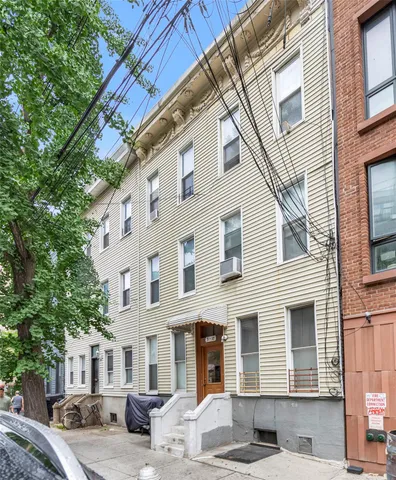a view of a building with a street