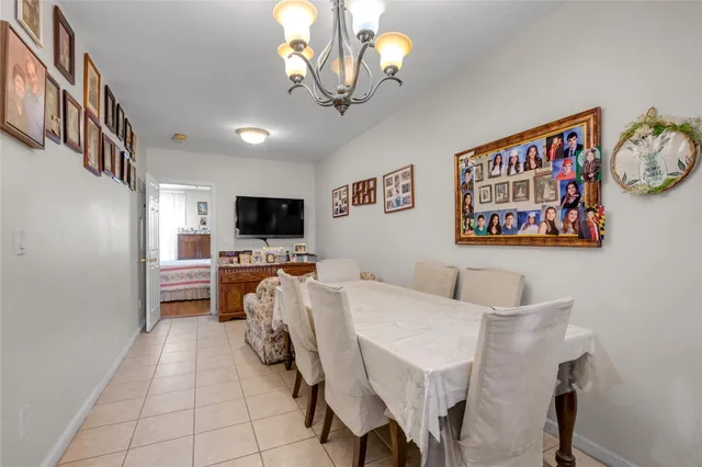 a view of a livingroom with furniture and a flat screen tv