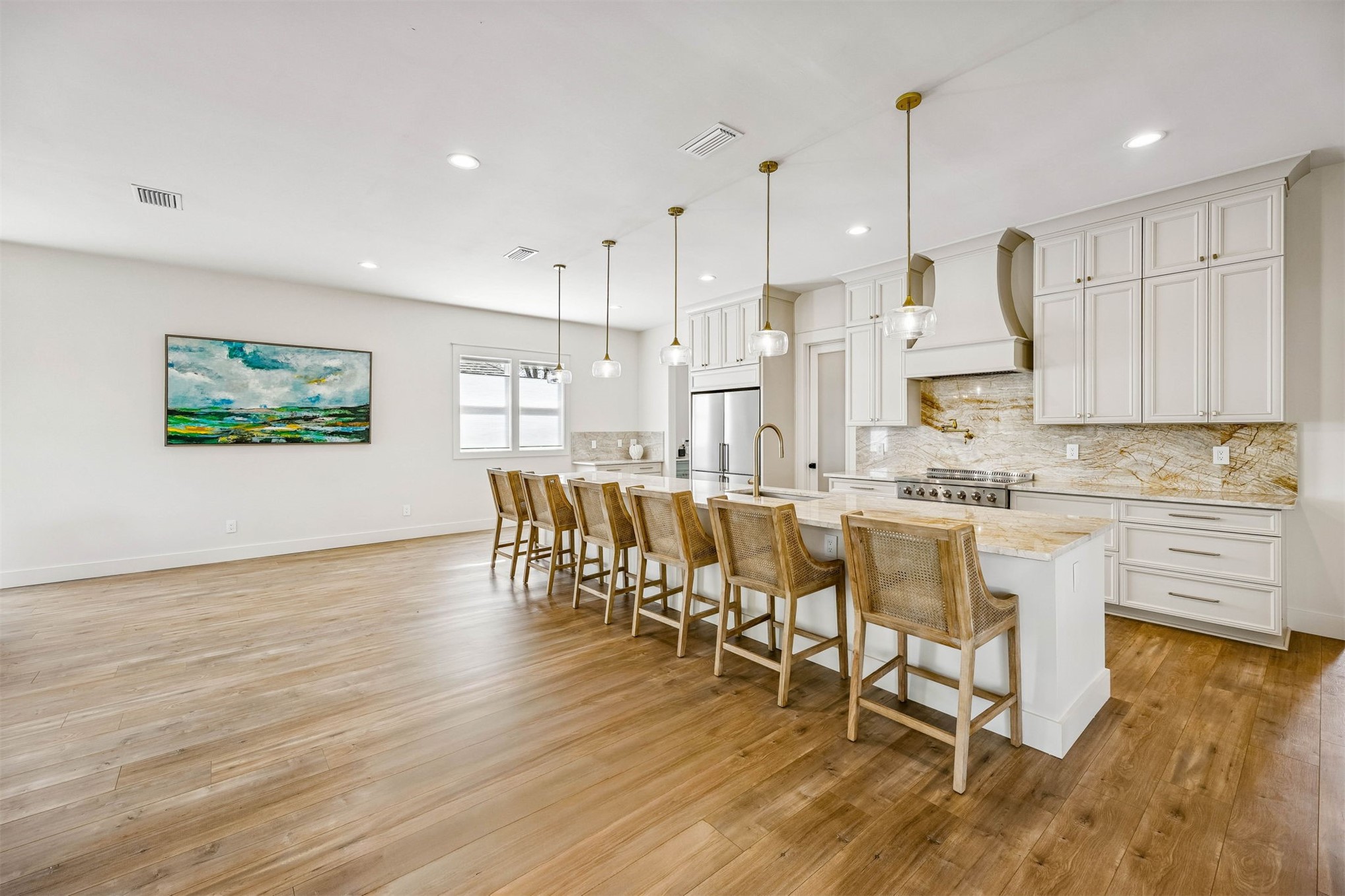 424 South 3rd Street Fernandina Beach, FL 32034 - Photo 7 of 38 a large kitchen with a table and chairs