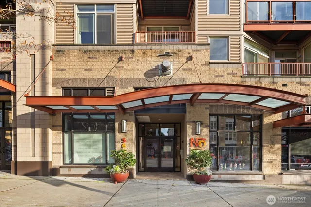 front view of a brick building with a large windows