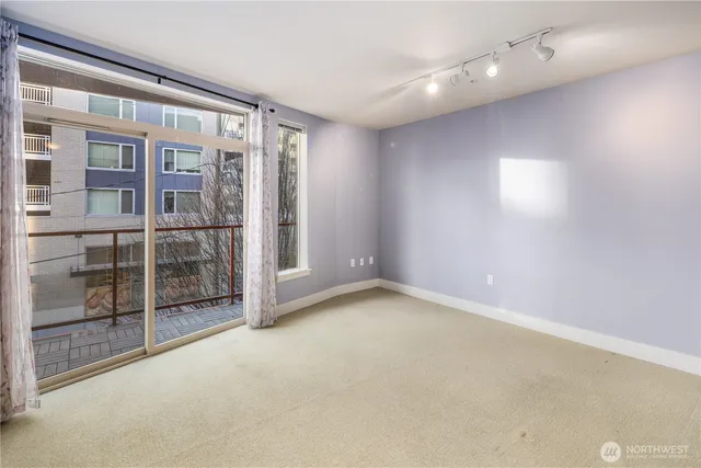 a view of an empty room with a window