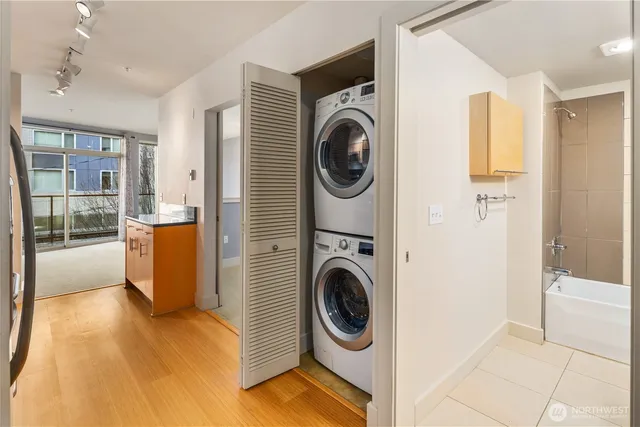 a view of a hallway with washer and dryer