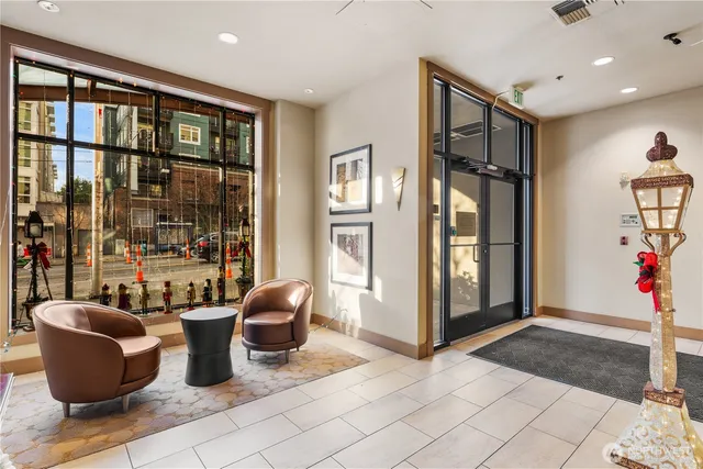 a living room with furniture plant and a potted plant