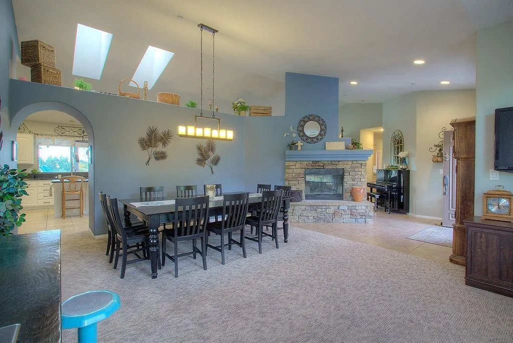 31028 Saddleback Road Valley Center, CA 92082 - Photo 11 of 21 a view of a a dining room with furniture window and wooden floor