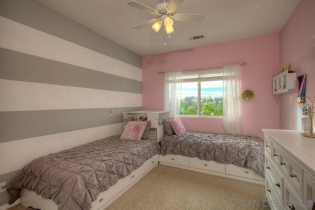 31028 Saddleback Road Valley Center, CA 92082 - Photo 7 of 21 a bedroom with a bed and a window