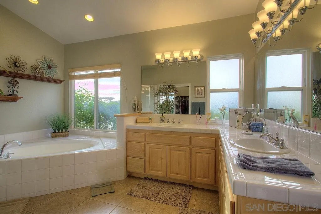 31028 Saddleback Road Valley Center, CA 92082 - Photo 10 of 21 a bathroom with a tub sink and mirror