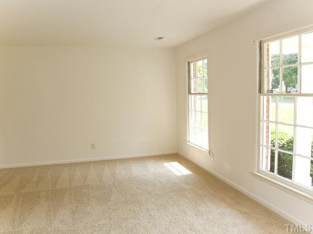3704 Bland Road Raleigh, NC 27609 - Photo 3 of 16 an empty room with windows