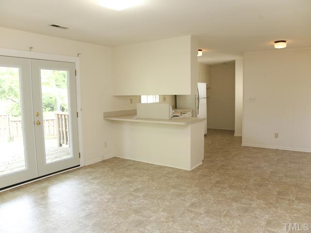 3704 Bland Road Raleigh, NC 27609 - Photo 4 of 16 a view of an empty room with a window