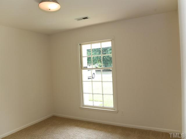 3704 Bland Road Raleigh, NC 27609 - Photo 5 of 16 an empty room with windows