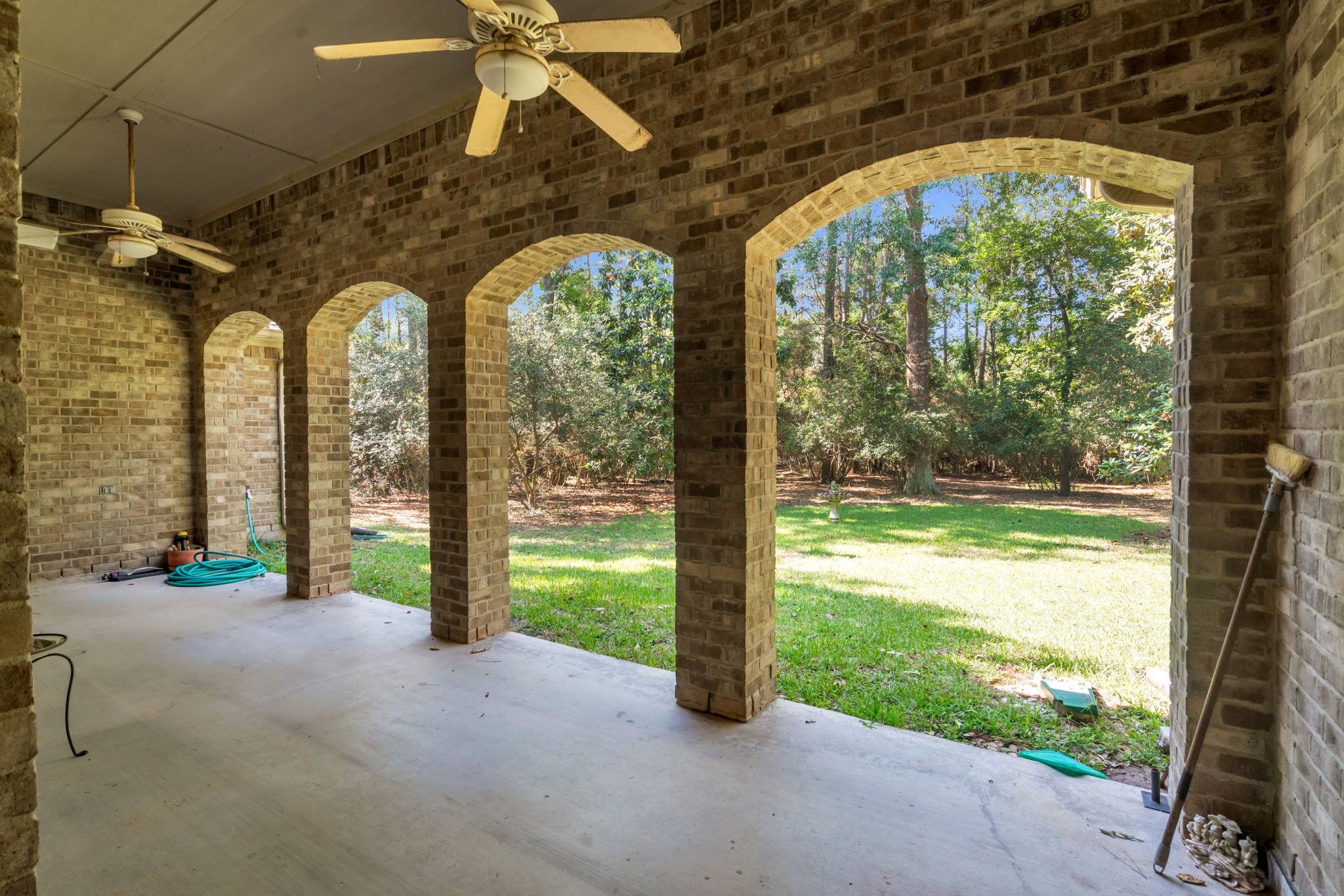 15501 Victoria's Way Montgomery, TX 77316 - Photo 32 of 36 Large covered patio with ceiling fans and outdoor speakers.