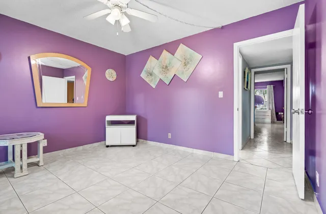 a view of a livingroom with a chandelier fan