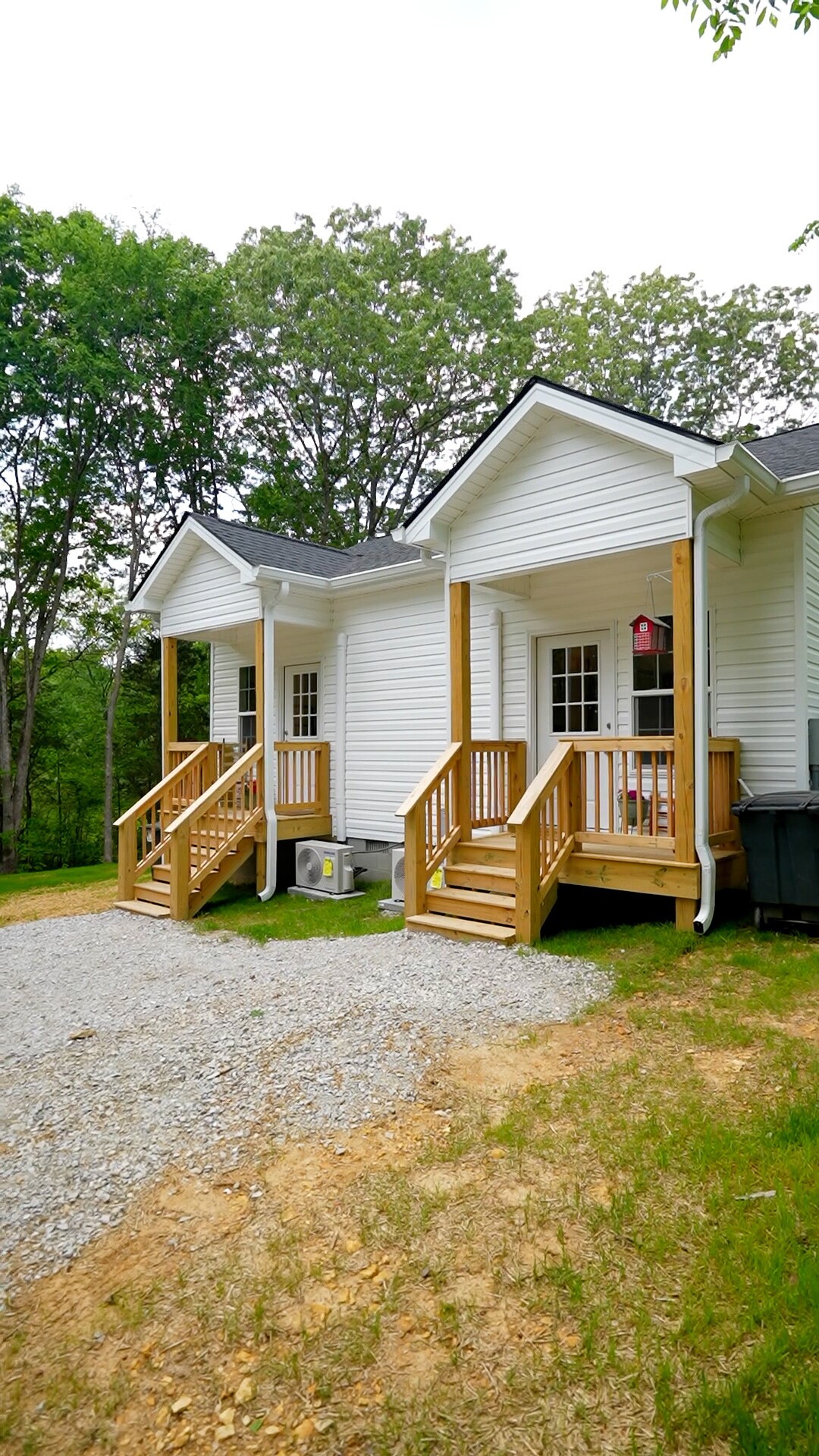 8055 Maple Street Lyles, TN 37098 - Photo 1 of 9 a front view of a house with garden