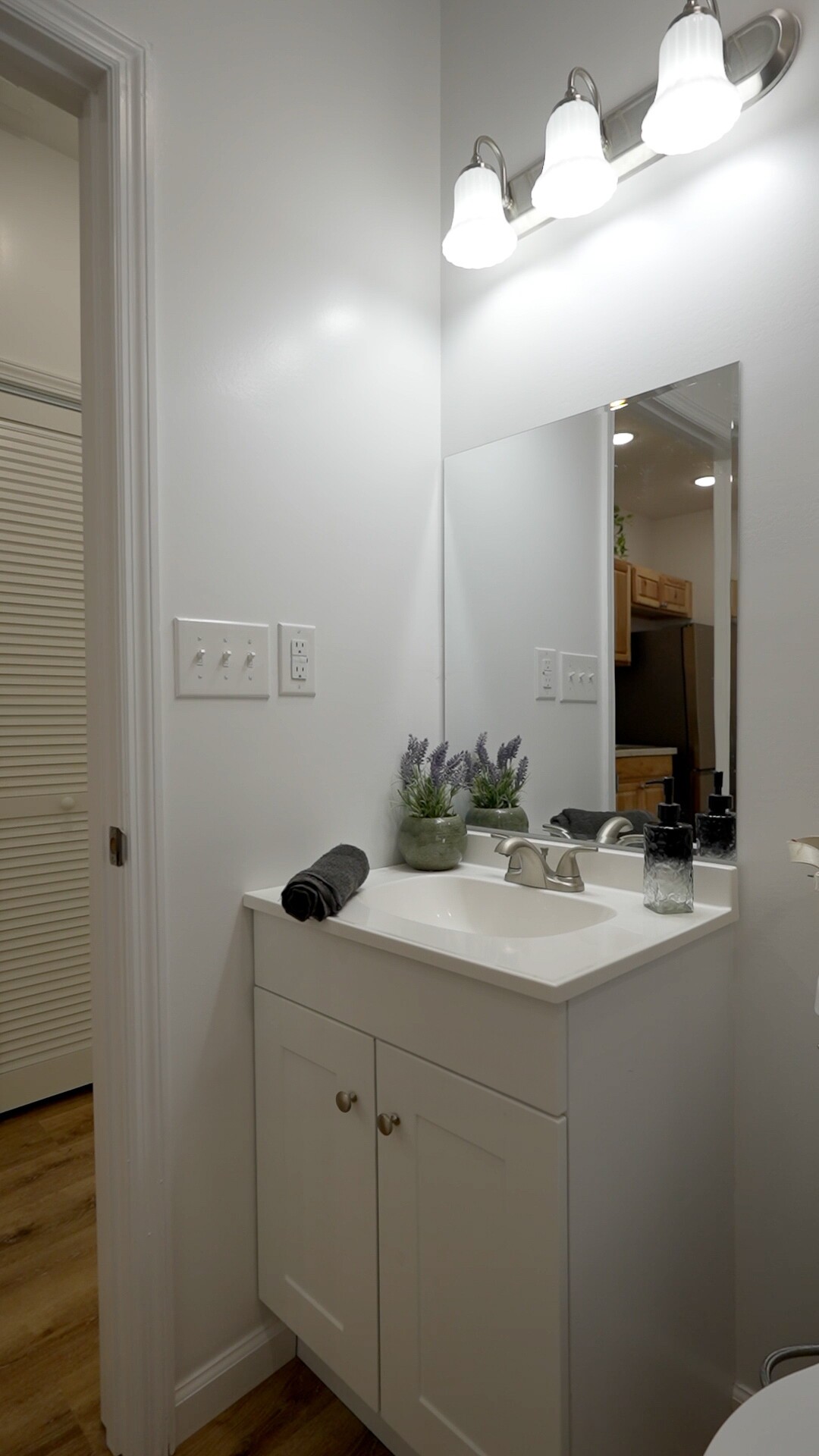 8055 Maple Street Lyles, TN 37098 - Photo 9 of 9 a bathroom with a sink vanity granite and a mirror
