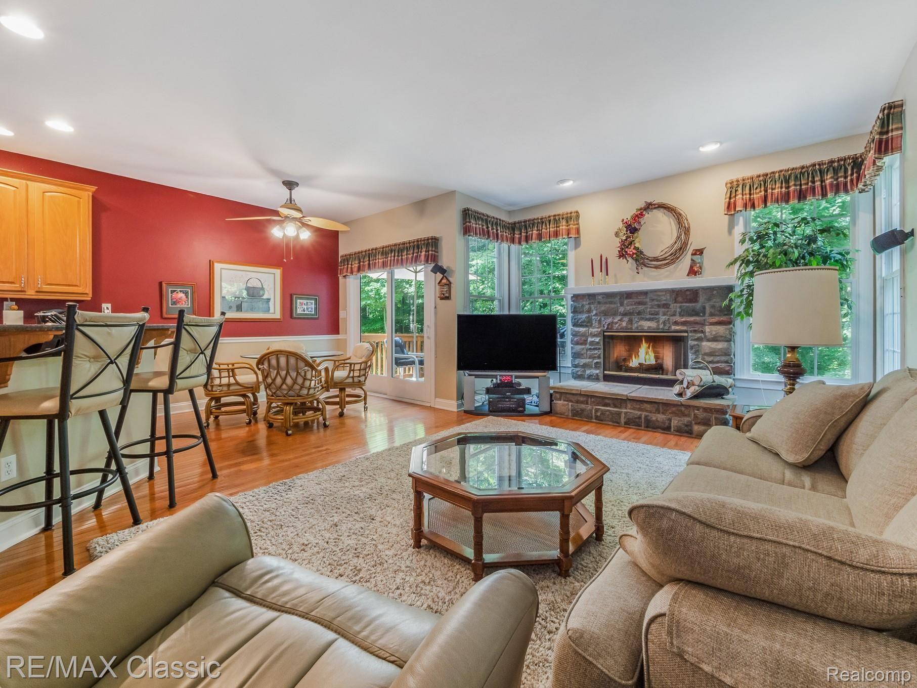 24936 Reeds Pointe Drive, Unit 43 Novi, MI 48374 - Photo 8 of 42 Family Room w/Stone Gas Fireplace, Snackbar & Breakfast Nook