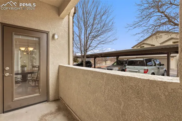 a view of a car park in front of a house