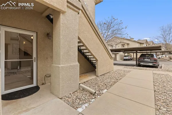a view of a balcony with car parked