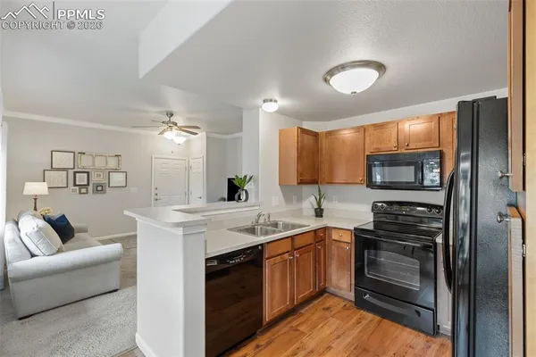 a kitchen with a sink stove and refrigerator