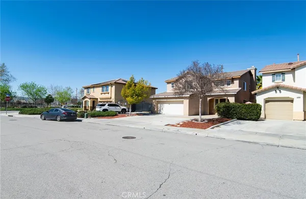 front view of a house with a street view