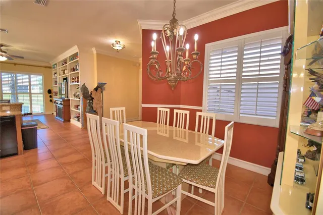 a bedroom with a bed and ceiling fan