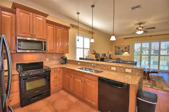 a view of walk in closet with clothes