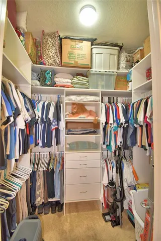 a aerial view of a house with a yard and a garage