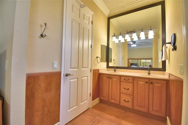 an aerial view of a house with a garden and lake view