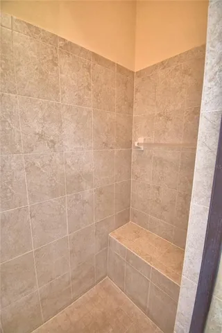 an aerial view of a house with a garden and lake view