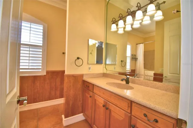 an aerial view of a house with garden space and a street view