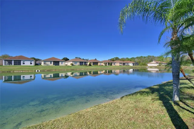 a living room with lots of furniture dining table and a chandelier