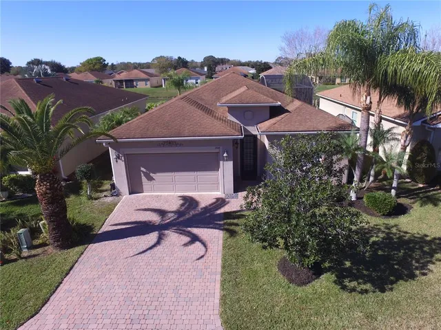a large kitchen with stainless steel appliances lots of counter top space and living room