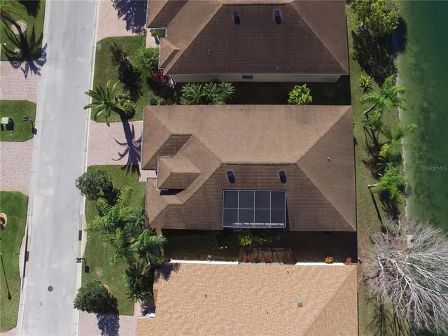 a view of a house with backyard porch and sitting area