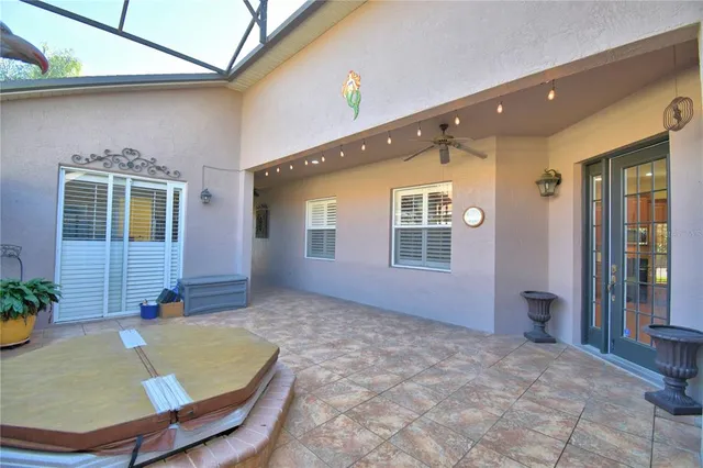 a dining area with a table chairs and a kitchen view