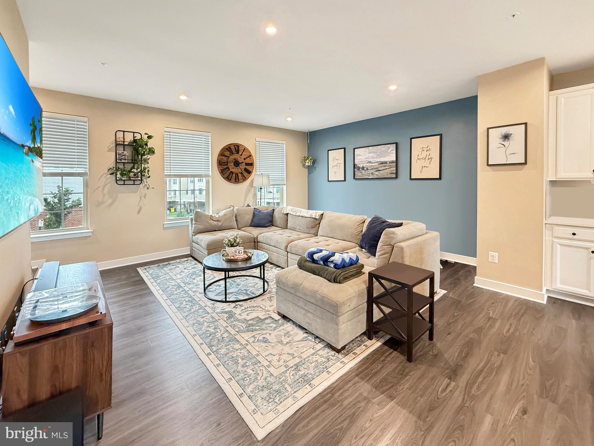 7820 Mine Run Road Hanover, MD 21076 - Photo 17 of 31 a living room with furniture and a wooden floor