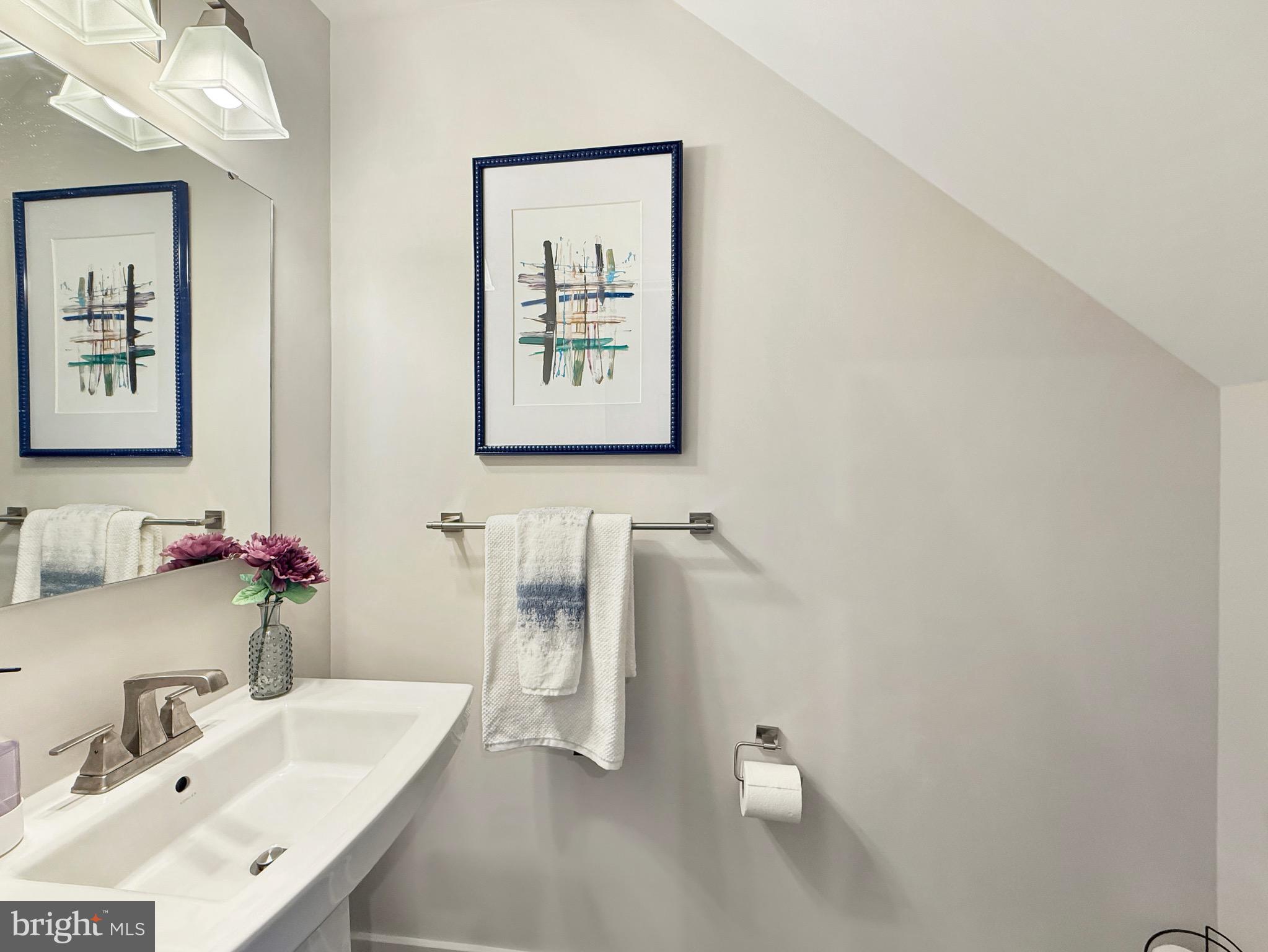 7820 Mine Run Road Hanover, MD 21076 - Photo 18 of 31 a bathroom with a sink and a mirror