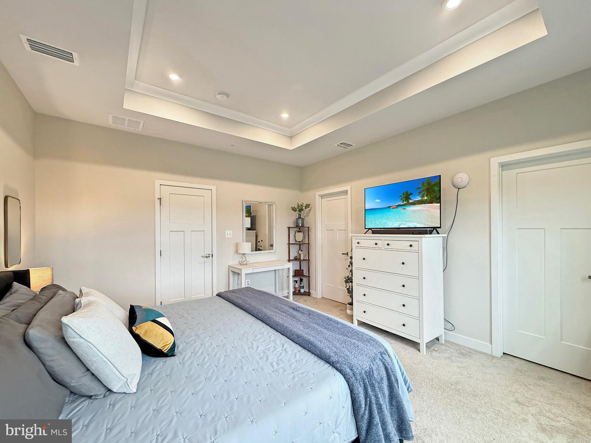 7820 Mine Run Road Hanover, MD 21076 - Photo 22 of 31 a bedroom with a bed and a dresser in it