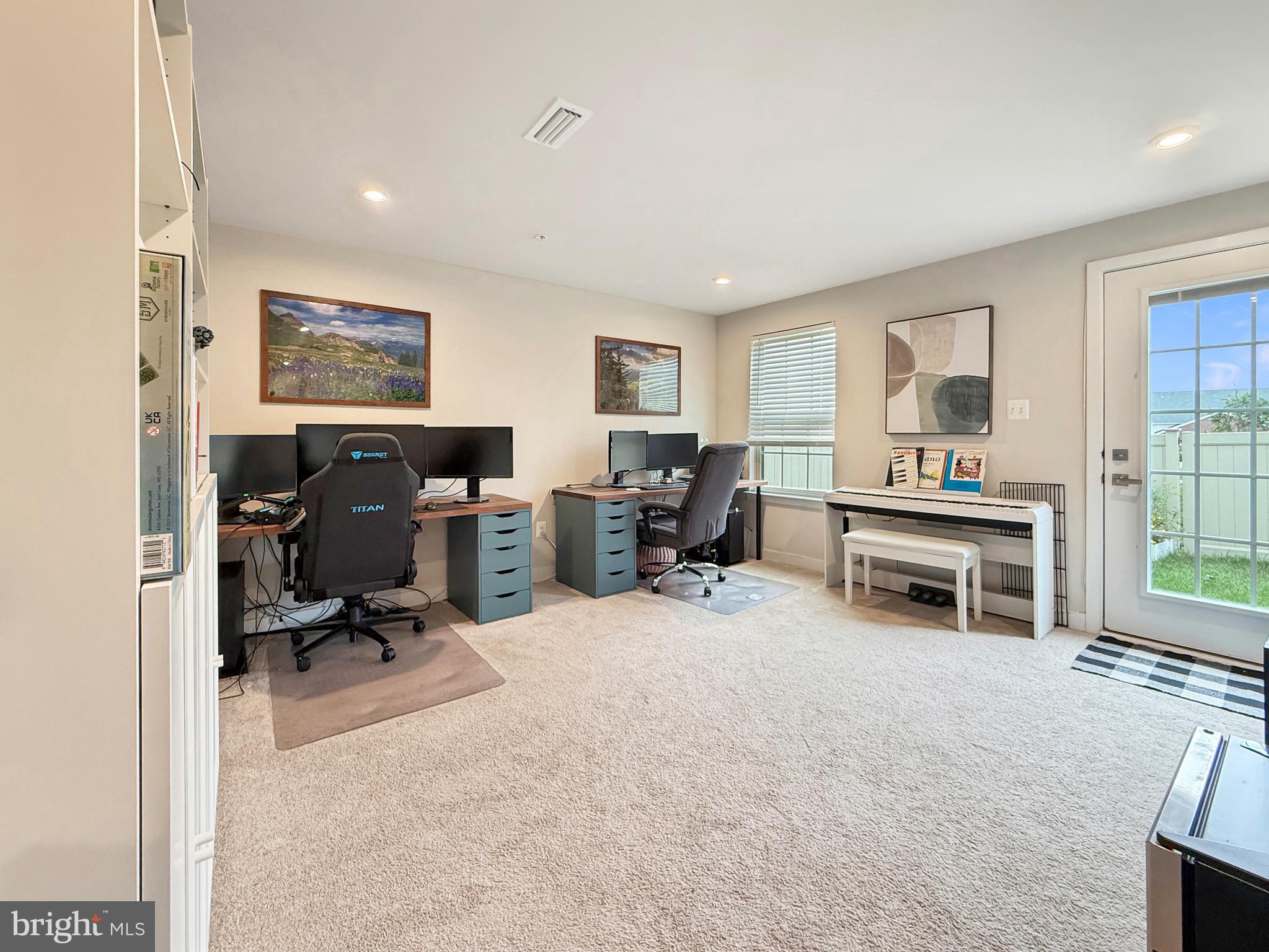 7820 Mine Run Road Hanover, MD 21076 - Photo 10 of 31 a living room with furniture a computer on the desk and a large window