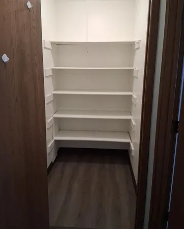 a kitchen with a sink and a refrigerator