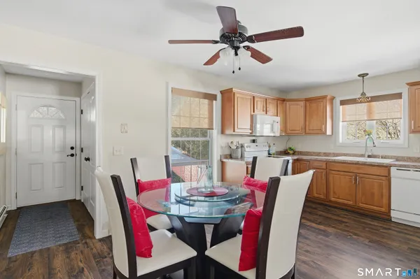 a view of a dining room with furniture window and wooden floor