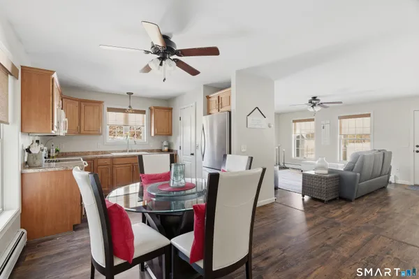 a view of a dining room with furniture window and wooden floor