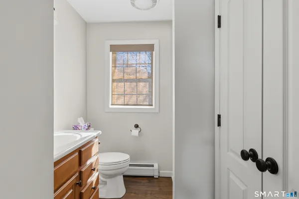 a white toilet sitting next to a bathroom sink