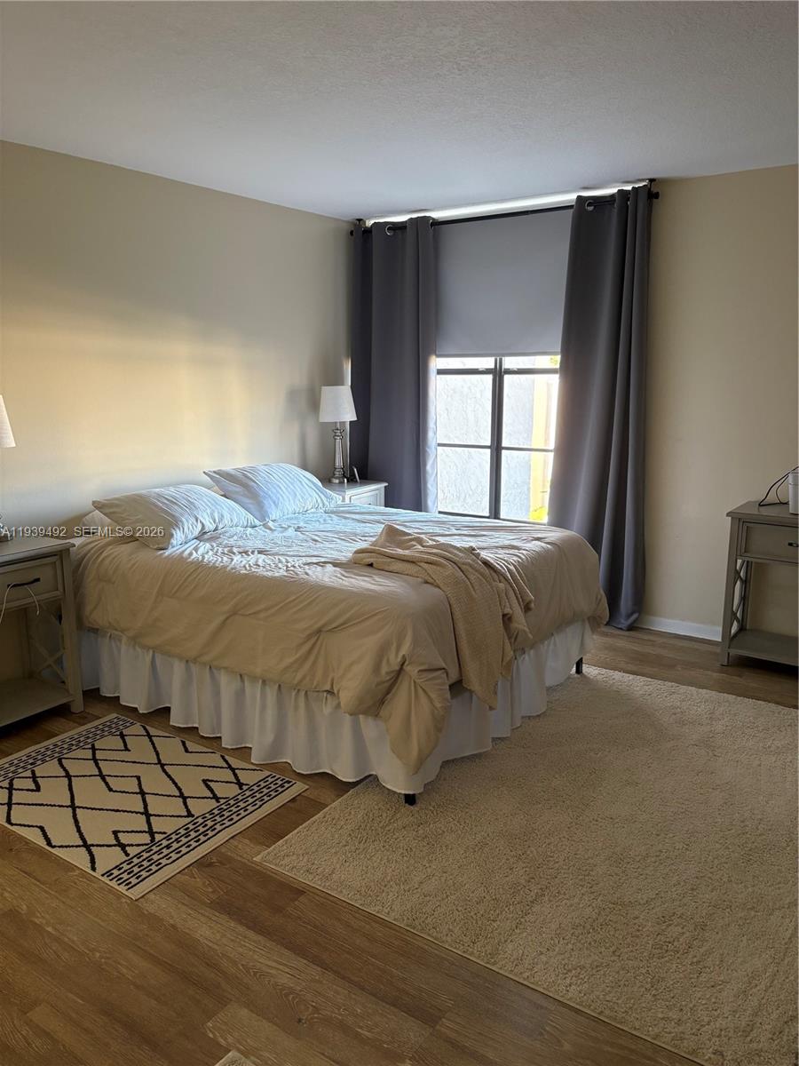 17 Royal Palm Way, Unit 4040 Boca Raton, FL 33432 - Photo 5 of 11 a bedroom with a bed and a window
