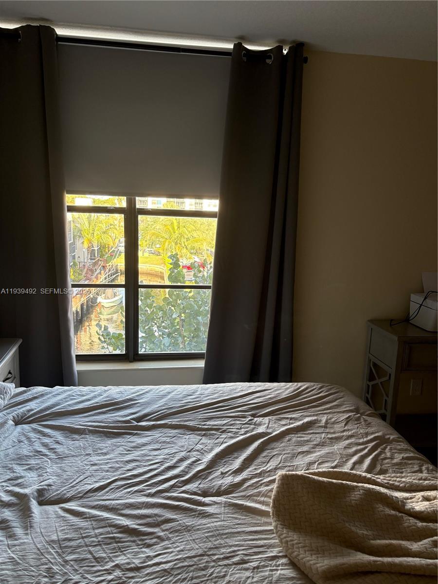 17 Royal Palm Way, Unit 4040 Boca Raton, FL 33432 - Photo 6 of 11 a bedroom with a bed and a window