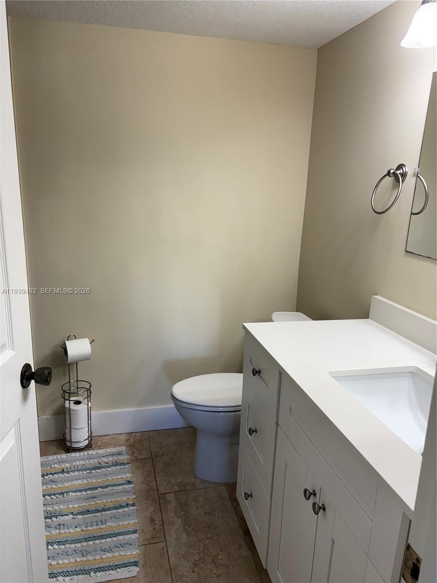 17 Royal Palm Way, Unit 4040 Boca Raton, FL 33432 - Photo 7 of 11 a bathroom with a sink a toilet and a shower