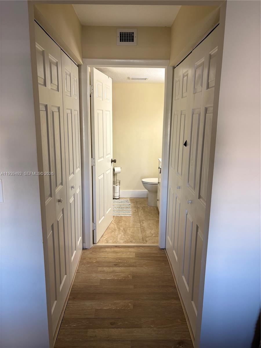 17 Royal Palm Way, Unit 4040 Boca Raton, FL 33432 - Photo 9 of 11 a view of a bathroom from a hallway