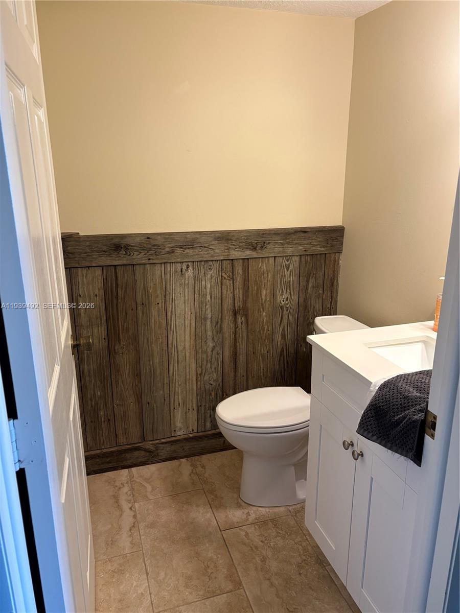 17 Royal Palm Way, Unit 4040 Boca Raton, FL 33432 - Photo 10 of 11 a white toilet sitting next to a small sink