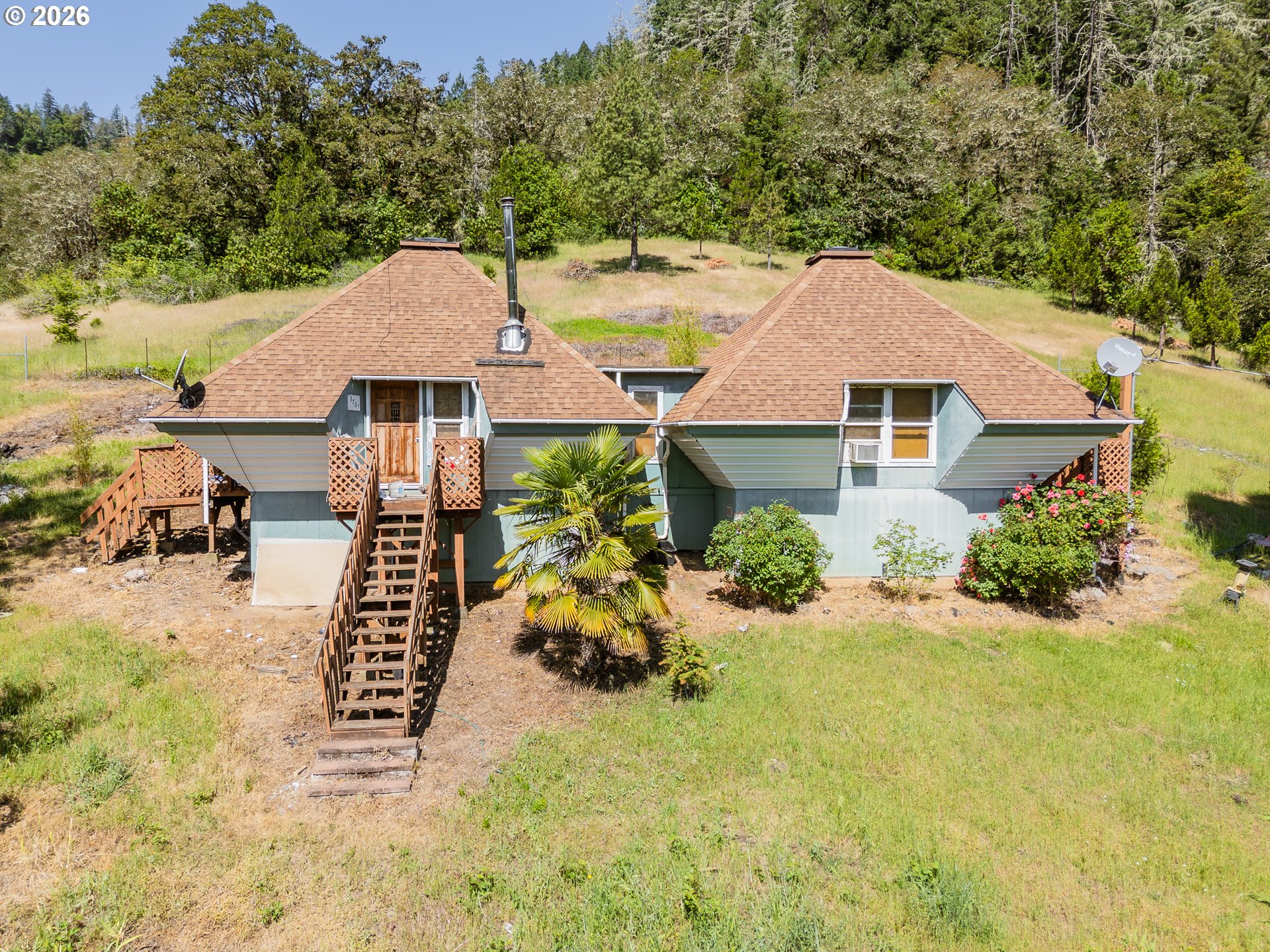 3707 Willis Creek Road Winston, OR 97496 - Photo 1 of 30 a aerial view of a house with yard and sitting area