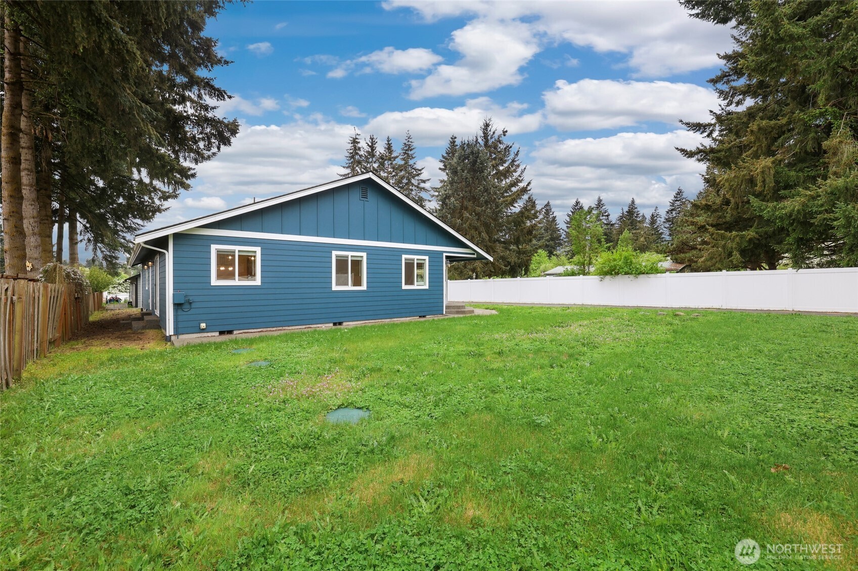 9815 178th Way Southwest Rochester, WA 98579 - Photo 33 of 36 a view of a yard with a house and garden